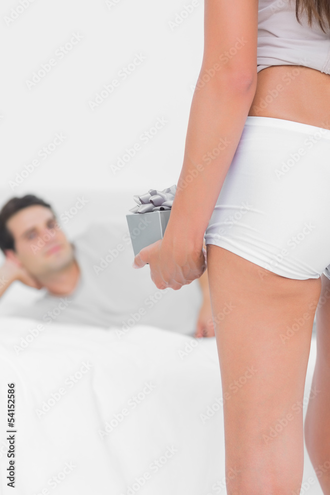 Fototapeta premium Woman giving a gift to her partner