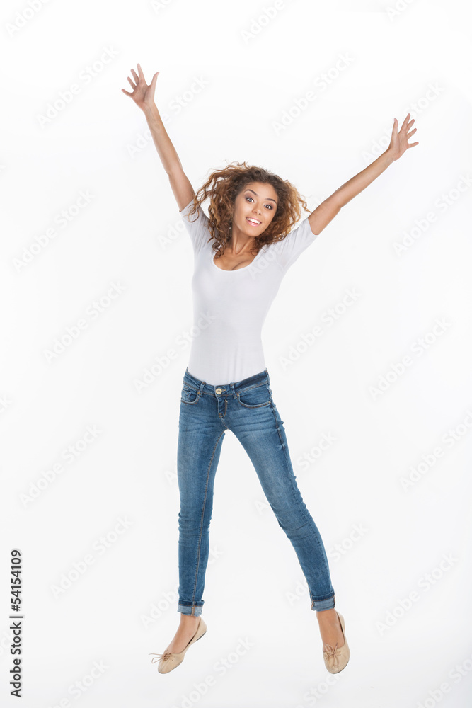 Women jumping. Happy young women jumping against the white backg Women jumping. Happy young women jumping against the white backg