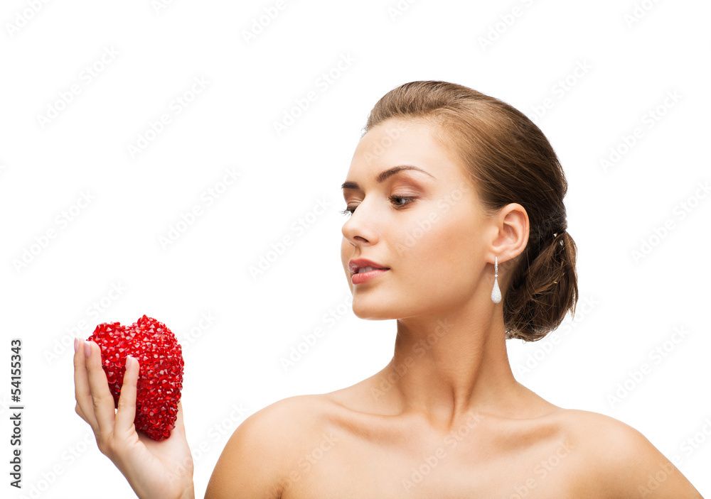 woman wearing shiny diamond earrings woman wearing shiny diamond earrings