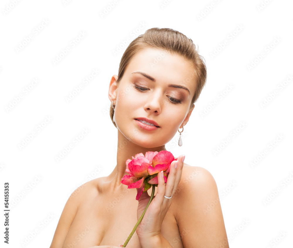 woman with diamond earrings, ring and flower woman with diamond earrings, ring and flower