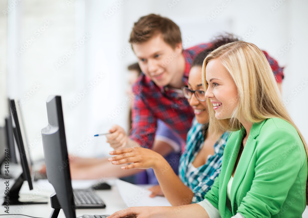 students with computer studying at school students with computer studying at school