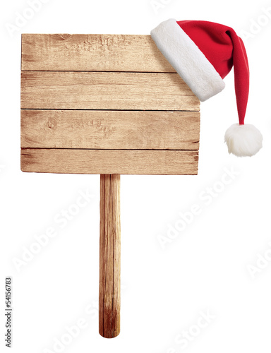 wooden road sign with red Santa's hat hanging isolated on white
