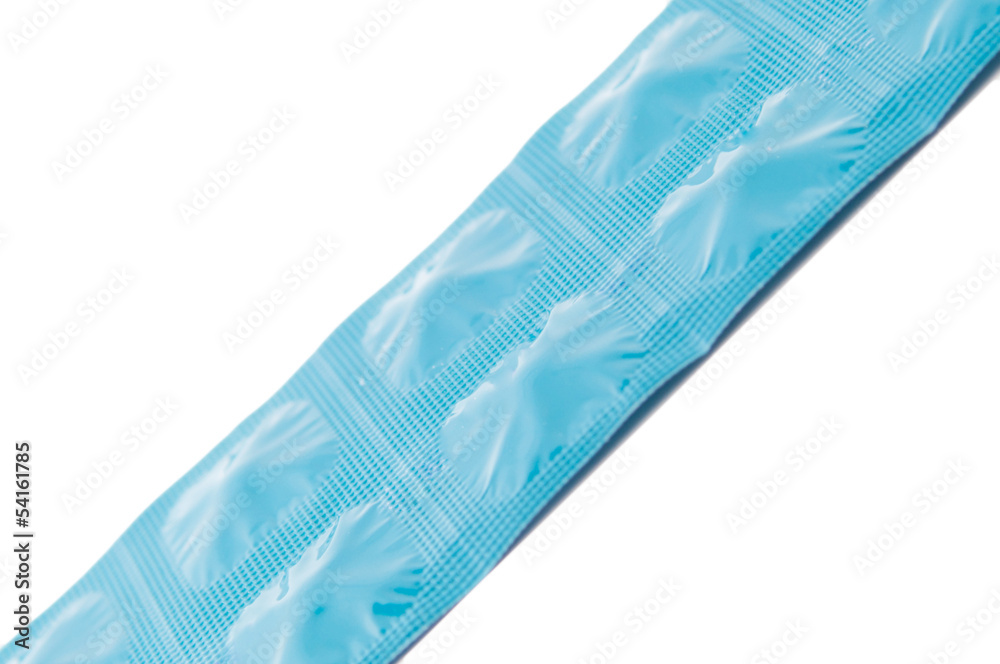 Closed up side of tablet in blue aluminum foil strip Closed up side of tablet in blue aluminum foil strip