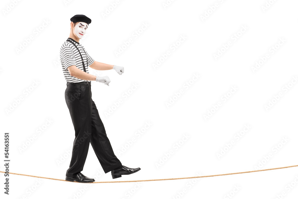 Full length portrait of a male mime artist walking on a rope Stock ...