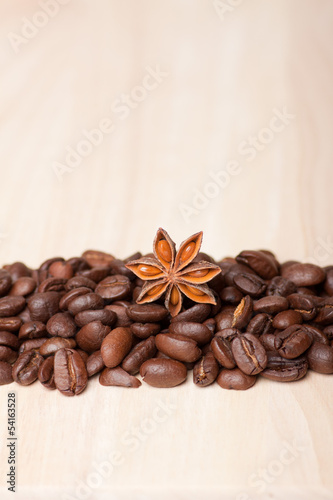 coffee beans on wooden surface background