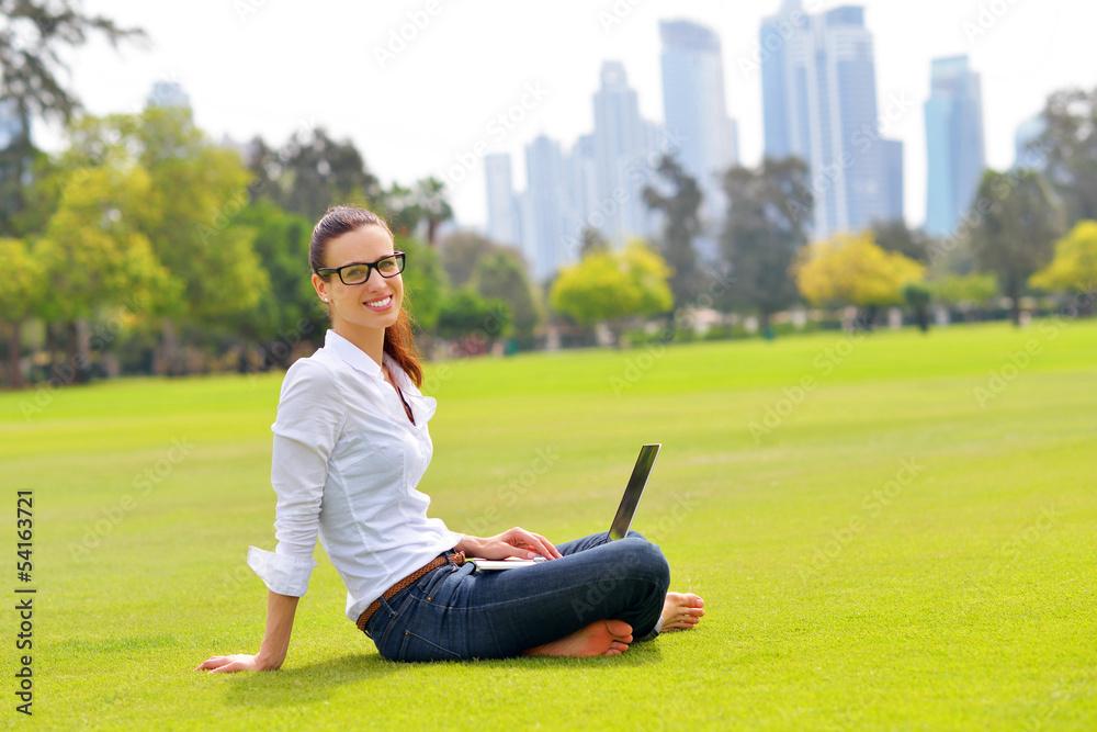 Fototapeta premium woman with laptop in park