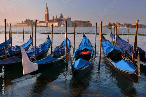 Relaxing evening in gondolas harbor, Venice