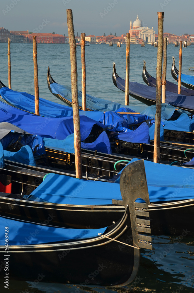 Early morning in gondolas harbor, Venice