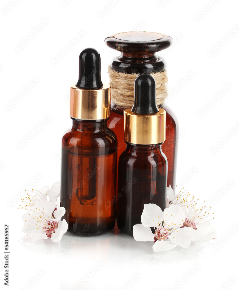 Aroma oils with flowers isolated on white