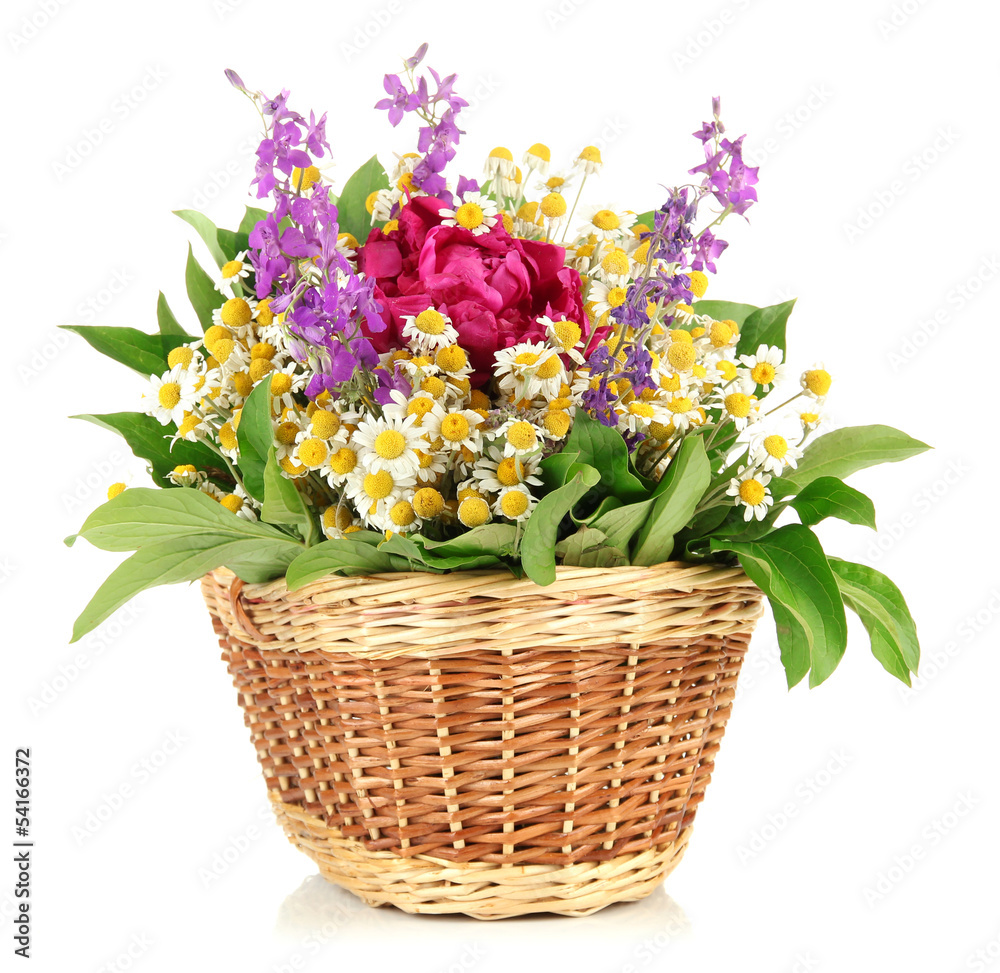 Bouquet of wild flowers in wicker basket, isolated on white