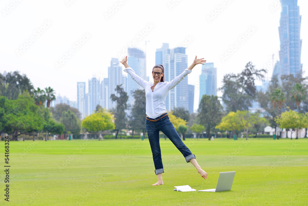 Fototapeta premium woman with laptop in park