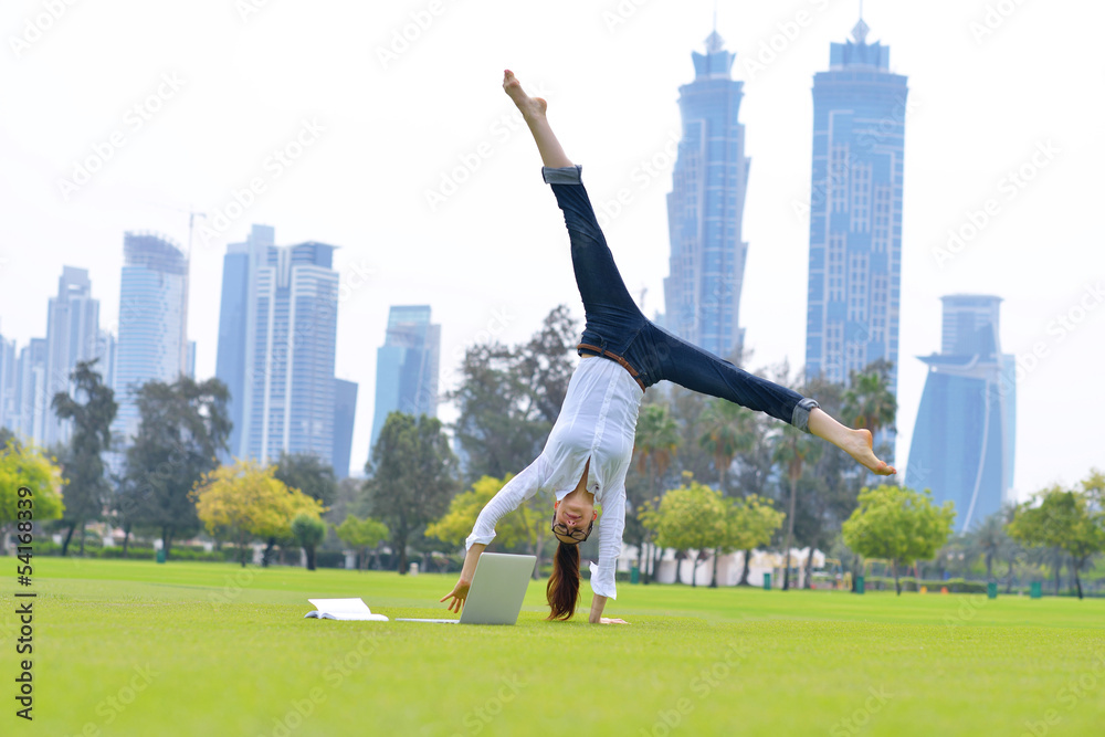 Fototapeta premium woman with laptop in park