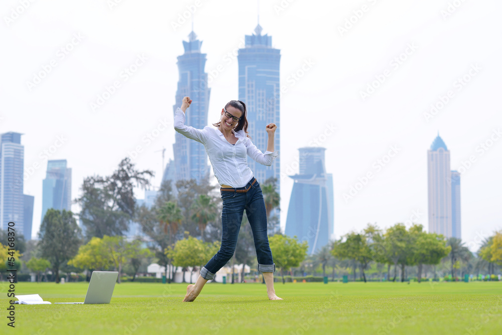 Fototapeta premium woman with laptop in park