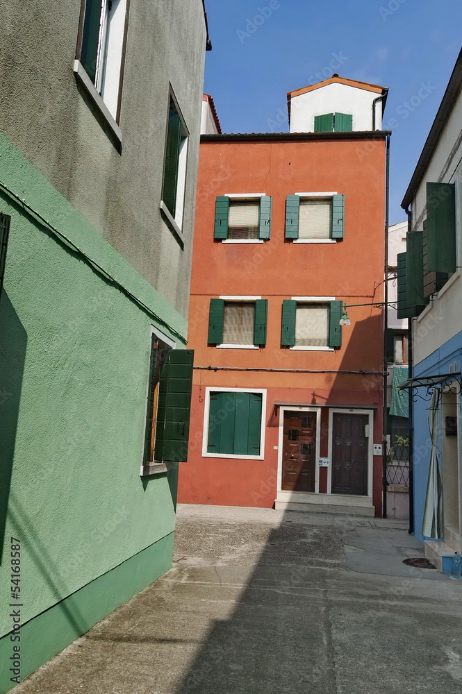 A narrow street in Burano island, Italy