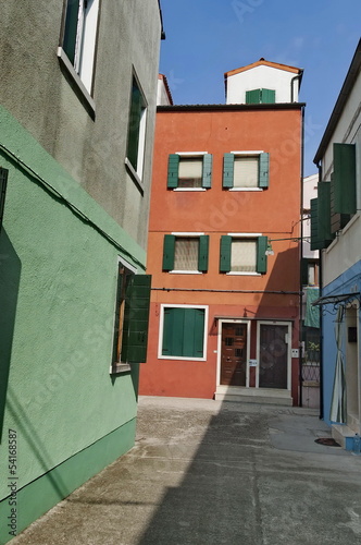 A narrow street in Burano island, Italy