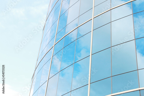 background of blue sky reflect on glasses from business buildin
