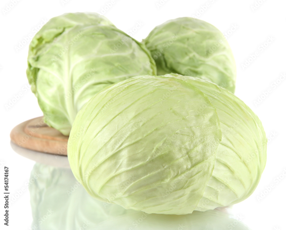 Cabbage on board for cutting isolated on white Cabbage on board for cutting isolated on white