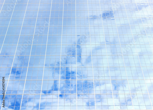 background of blue sky reflect on glasses from  business buildin