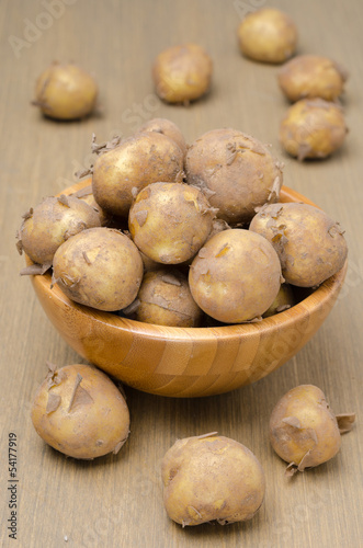 new potatoes in a bowl, vertical