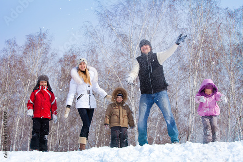 Family in winter parkl photo