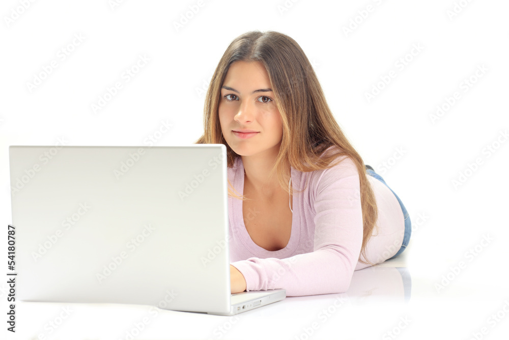 Beautiful young woman smiles while reading from a laptop compute Beautiful young woman smiles while reading from a laptop compute