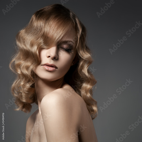 Beautiful Blond Woman. Curly Long Hair