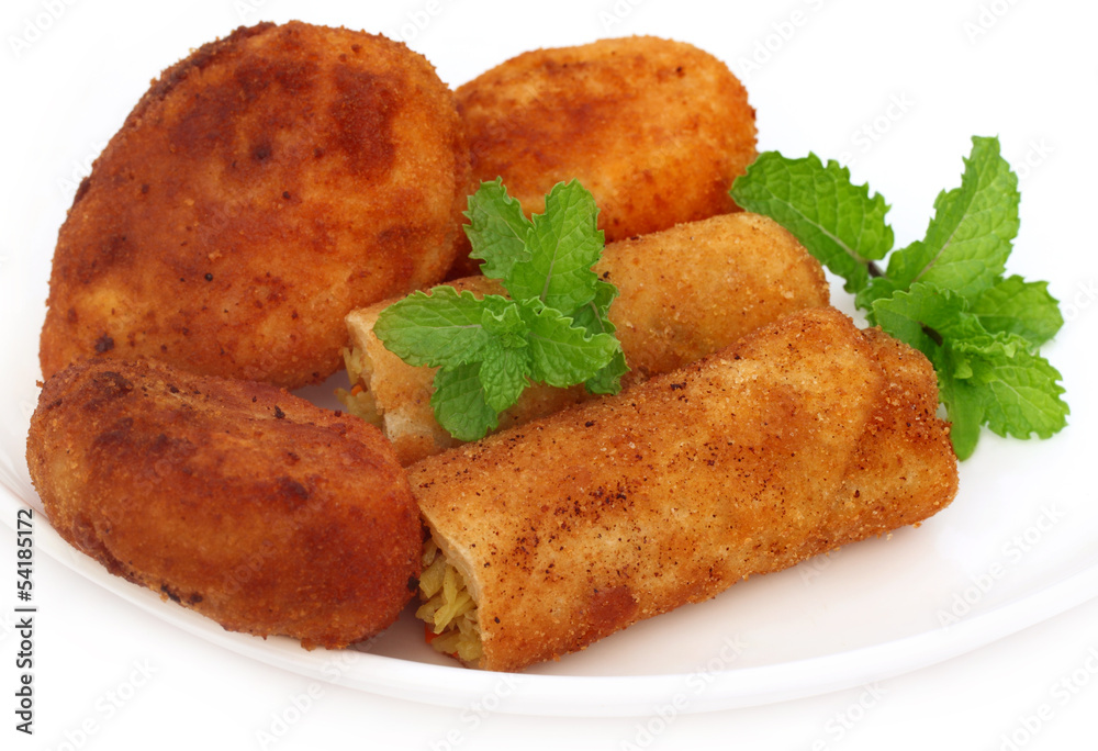 Vegetable roll with potato chop and fresh mint leaves Vegetable roll with potato chop and fresh mint leaves