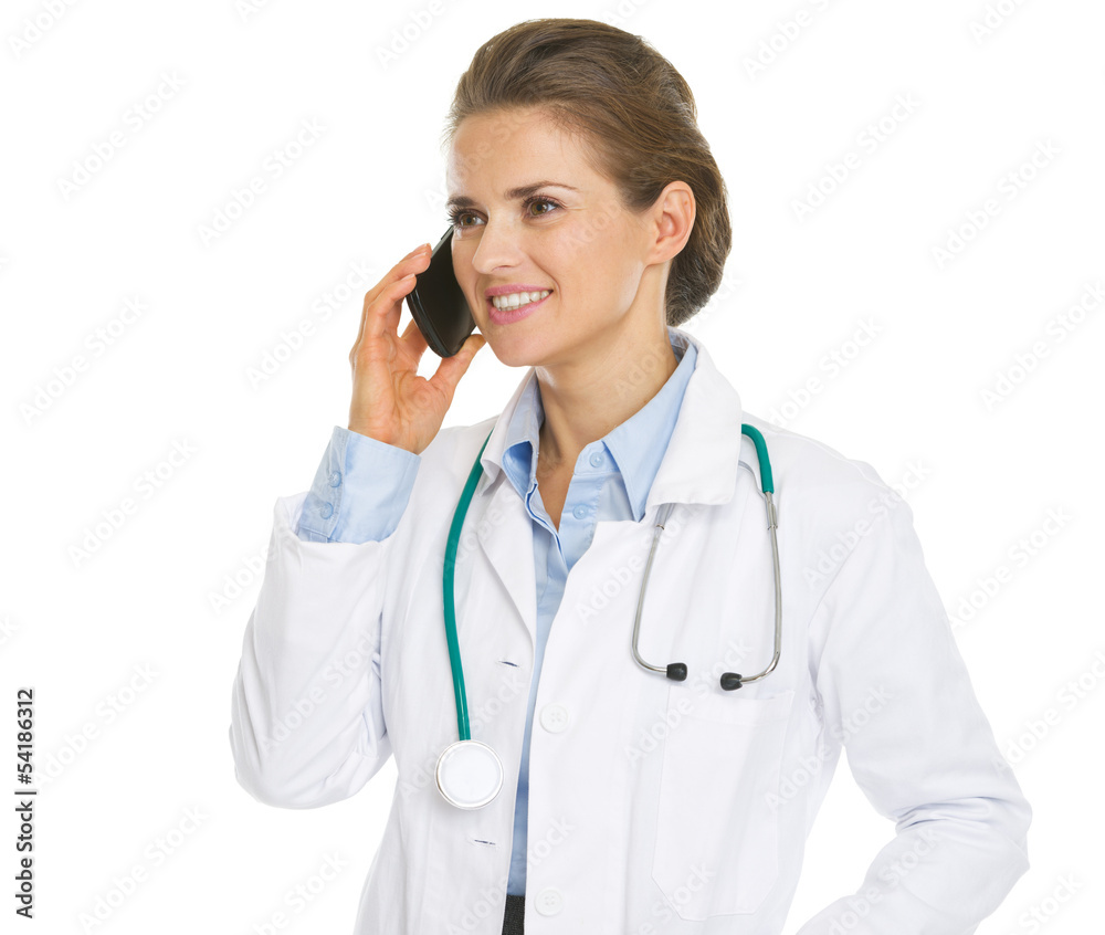 Smiling doctor woman talking cell phone Smiling doctor woman talking cell phone
