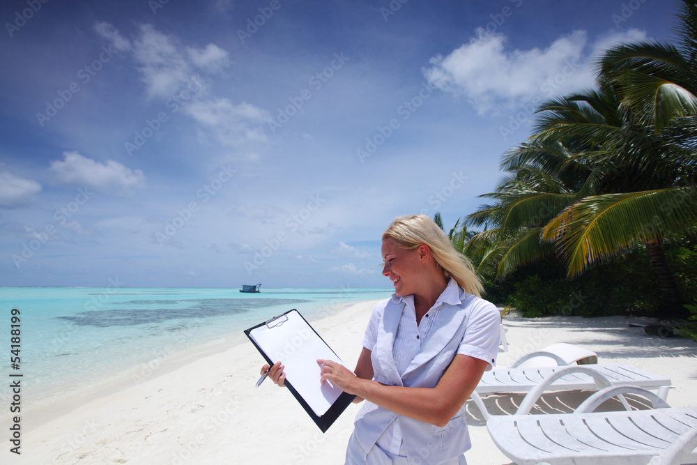 business woman with blank paper on the ocean coast