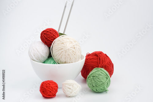 A lot of bright balls of knitting on the background photo