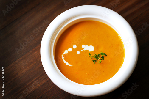 Slika na platnu Carrot and yam creamy soup with cream and thyme, appetizer