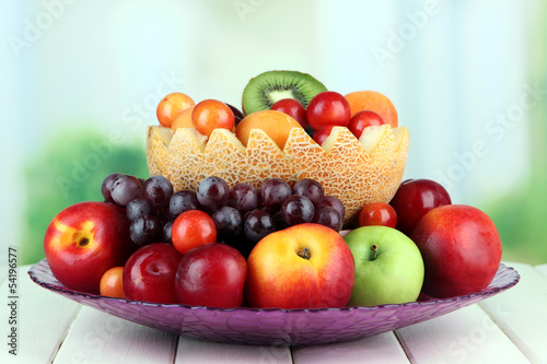 Fototapeta Naklejka Na Ścianę i Meble -  Assortment of juicy fruits on wooden table, on bright
