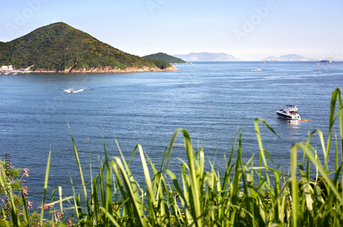 Boats on the blue sea off Hong Kong Island