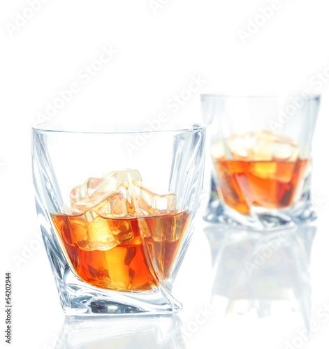 Two glasses of scotch whiskey, isolated on white