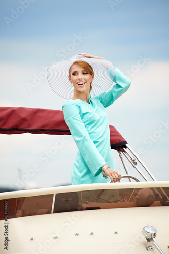 Summer woman on a yacht © ZoomTeam