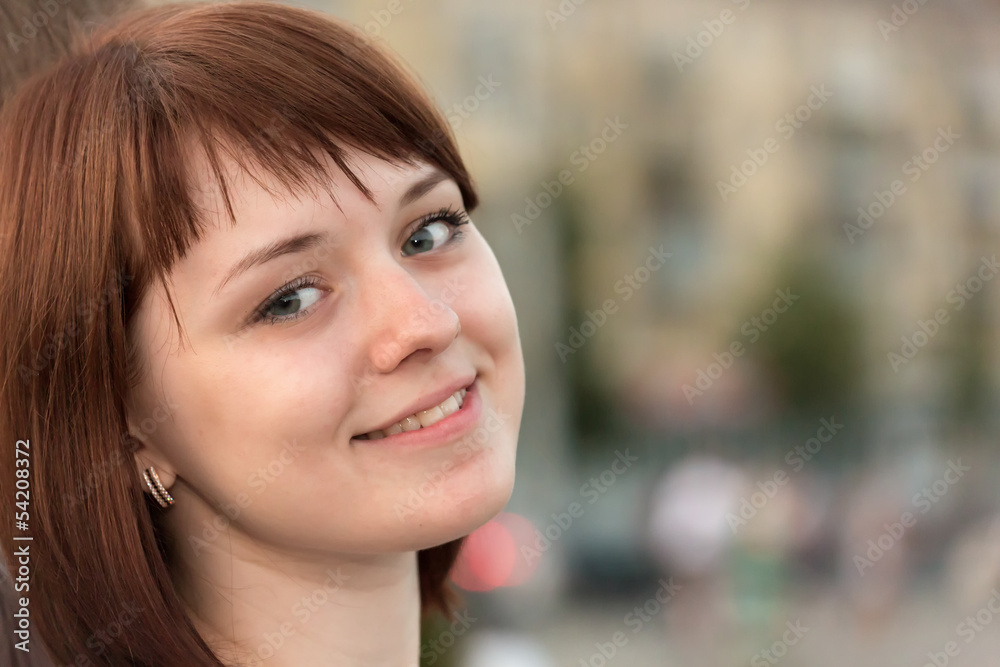 The portrait of the girl smiles