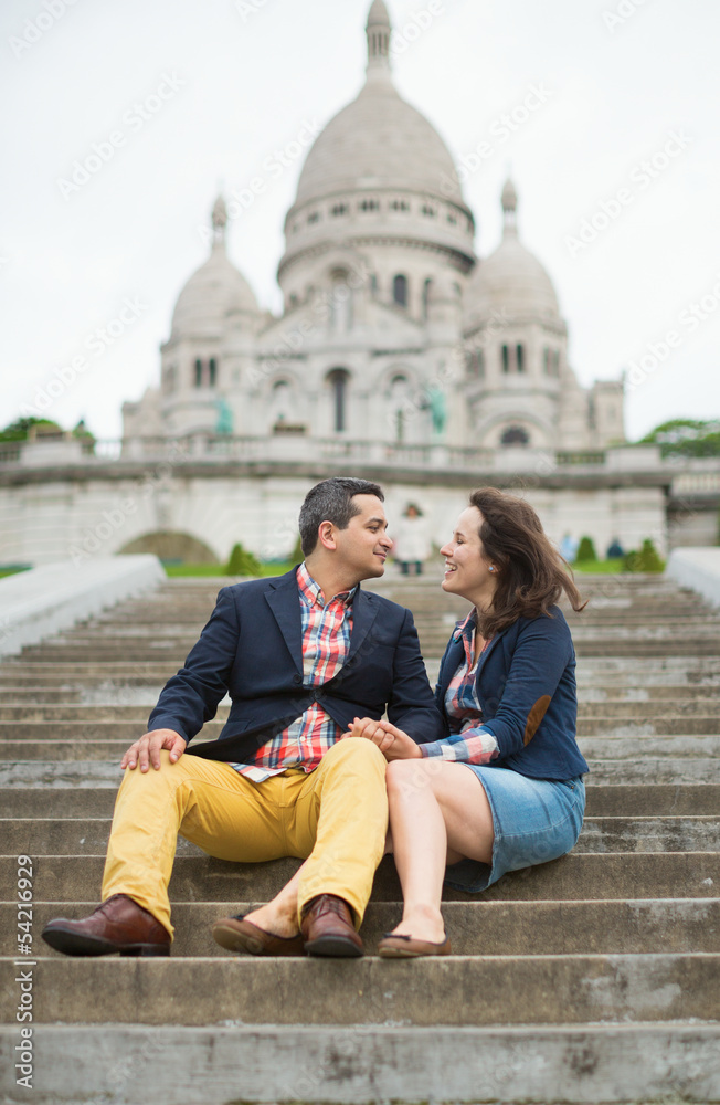Couple kissing near the Sacre-Coeur in Paris