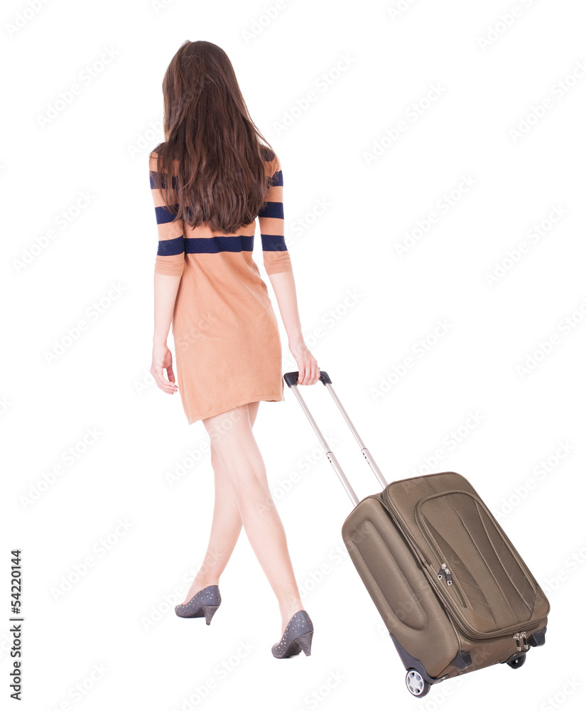 back view of walking woman with suitcase back view of walking woman with suitcase