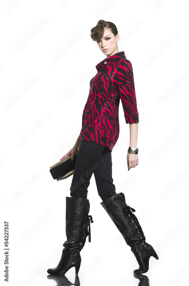young fashion model with purse walking on white background young fashion model with purse walking on white background