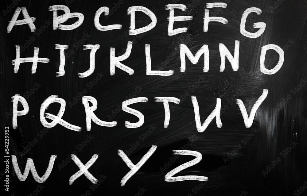 english alphabet handwritten with white chalk on a blackboard english alphabet handwritten with white chalk on a blackboard