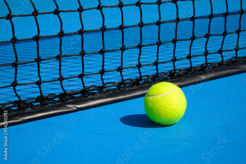 Tennis ball on tennis court © sutichak