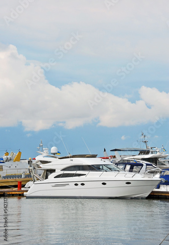 White motor yacht over harbor pier, Odessa, Ukraine