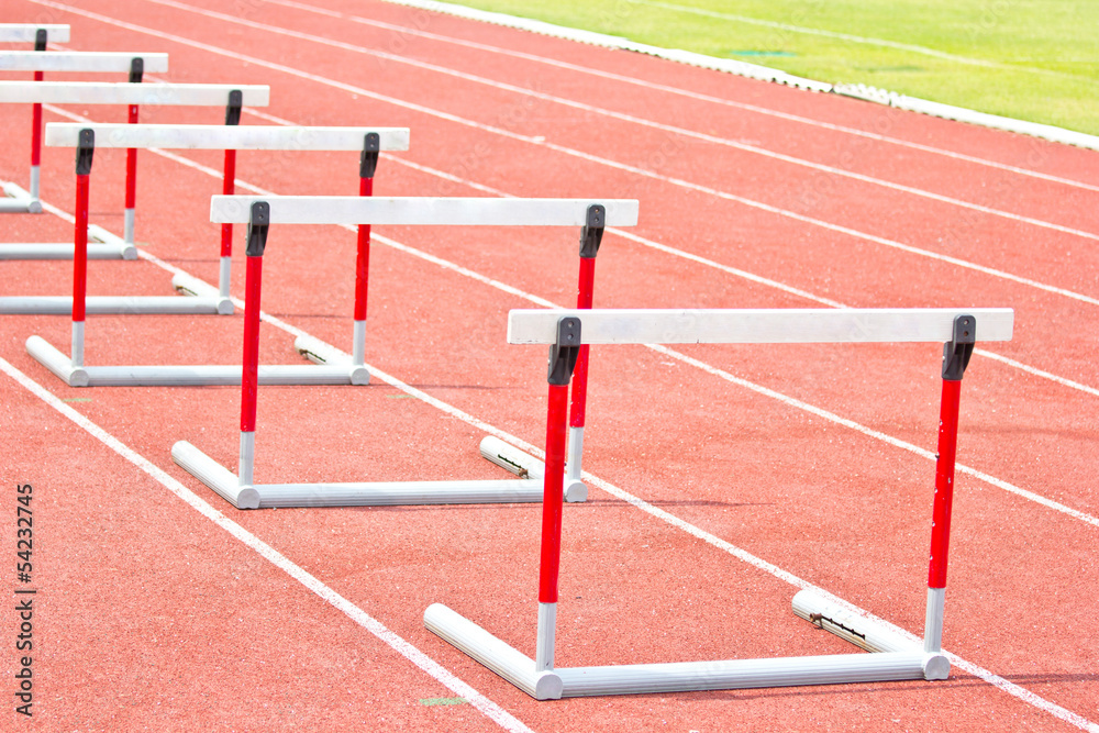 hurdles on the red running track