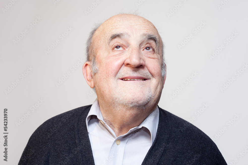 Fototapeta premium old man smiling and looking up