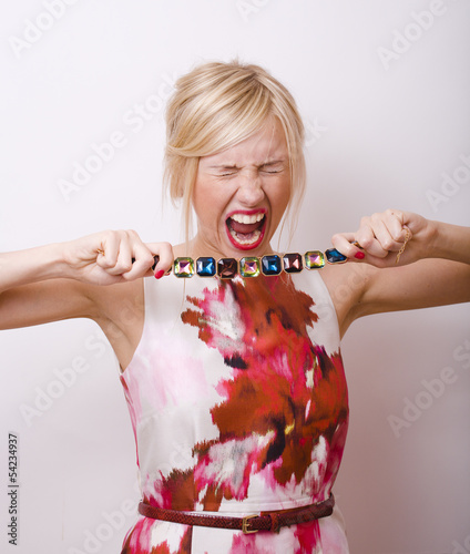 young pretty blonde girl presenting jewelry fashion at white copy space