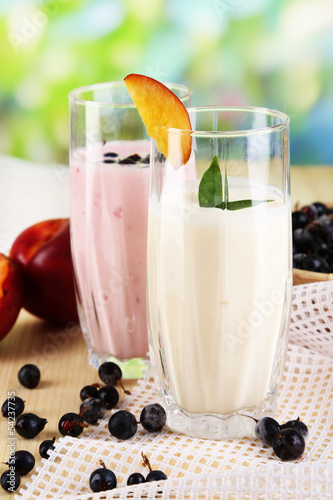 Delicious milk shakes with blackberry and peach