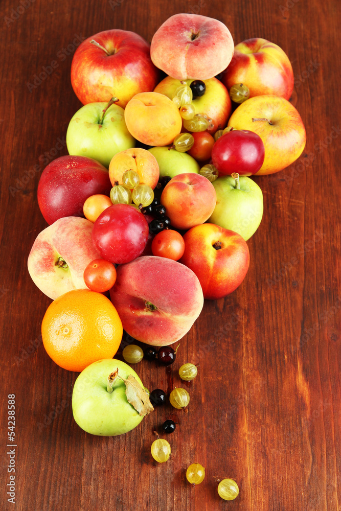 Assortment of juicy fruits, on wooden background Assortment of juicy fruits, on wooden background