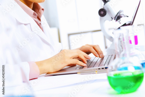 Young female scientist working in laboratory