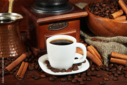 Coffee cup and metal turk on wooden background © Africa Studio