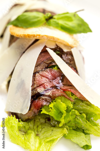 Beef carpaccio on a table in a restaurant photo